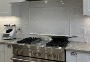 Herringbone Inset tile pattern with subway tile on kitchen back-splash